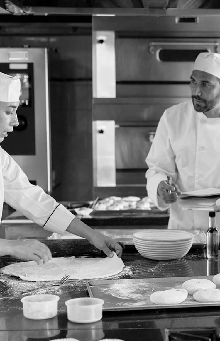Chefs collaborating in a professional kitchen