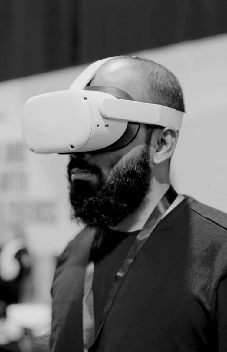 Person wearing a virtual reality headset during a gaming demonstration